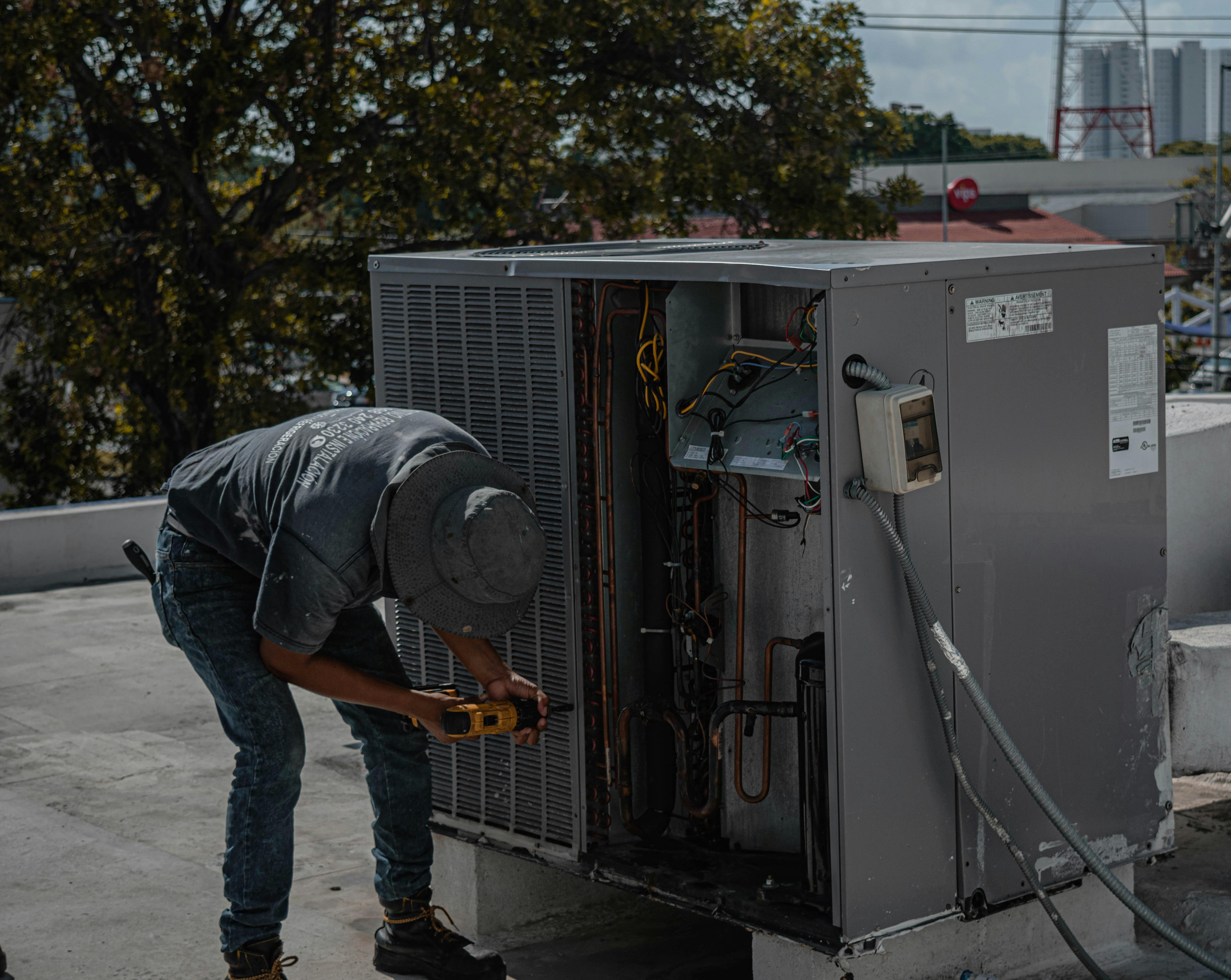 HVAC technician working on commercial unit in Ocala